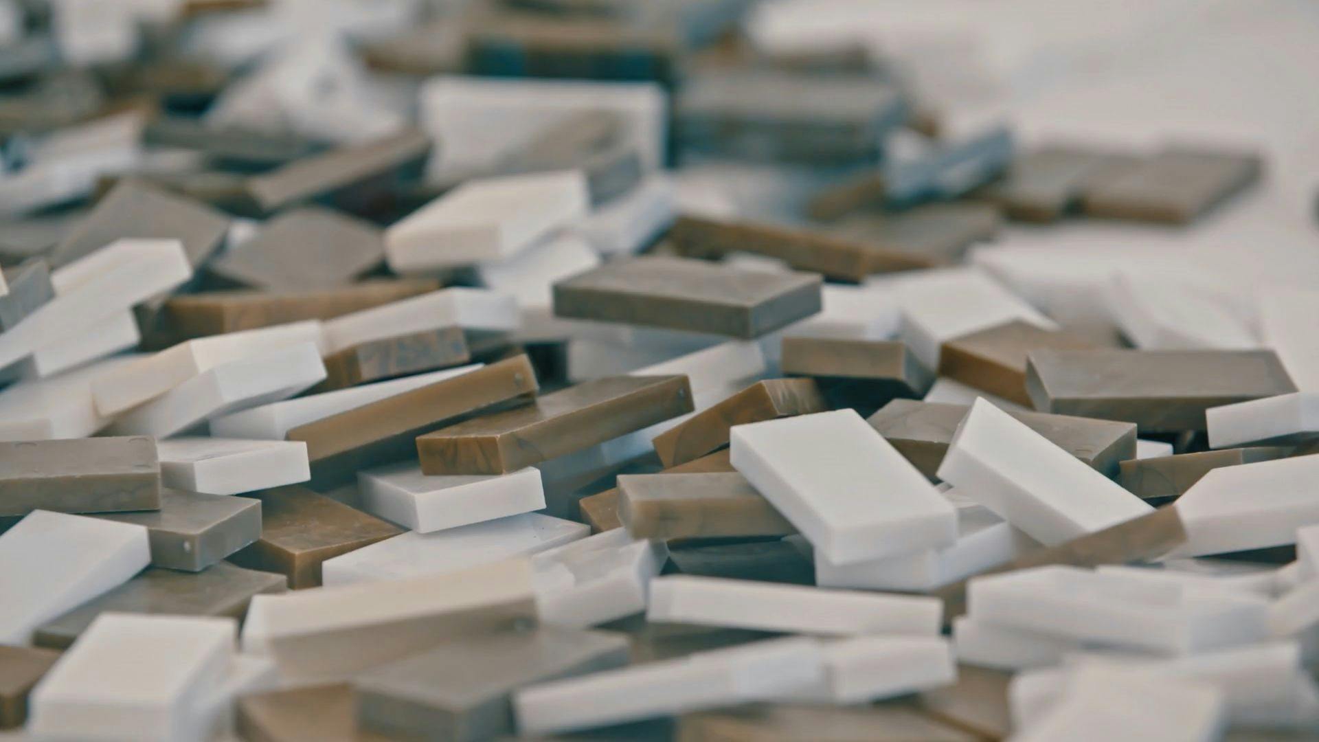A pile of white and golden dominoes